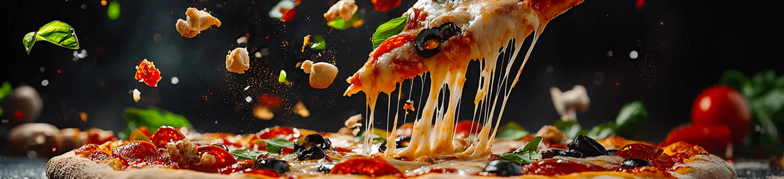 Loaded nachos platter piled high with queso, jalapeños, black beans, and sour cream ready to share